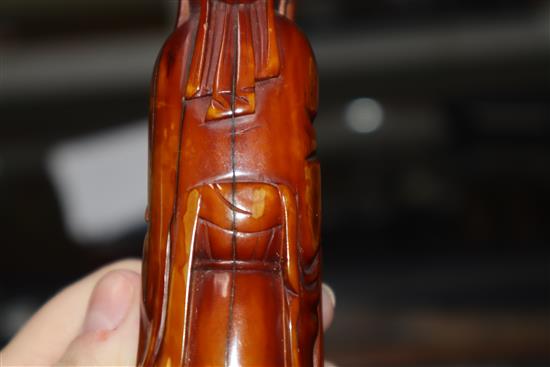 A 19th century Chinese stained marine ivory figure of Shou Lao